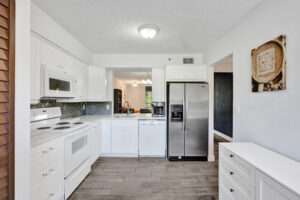 Open Clean Kitchen with Stackable Washer and Dryer!